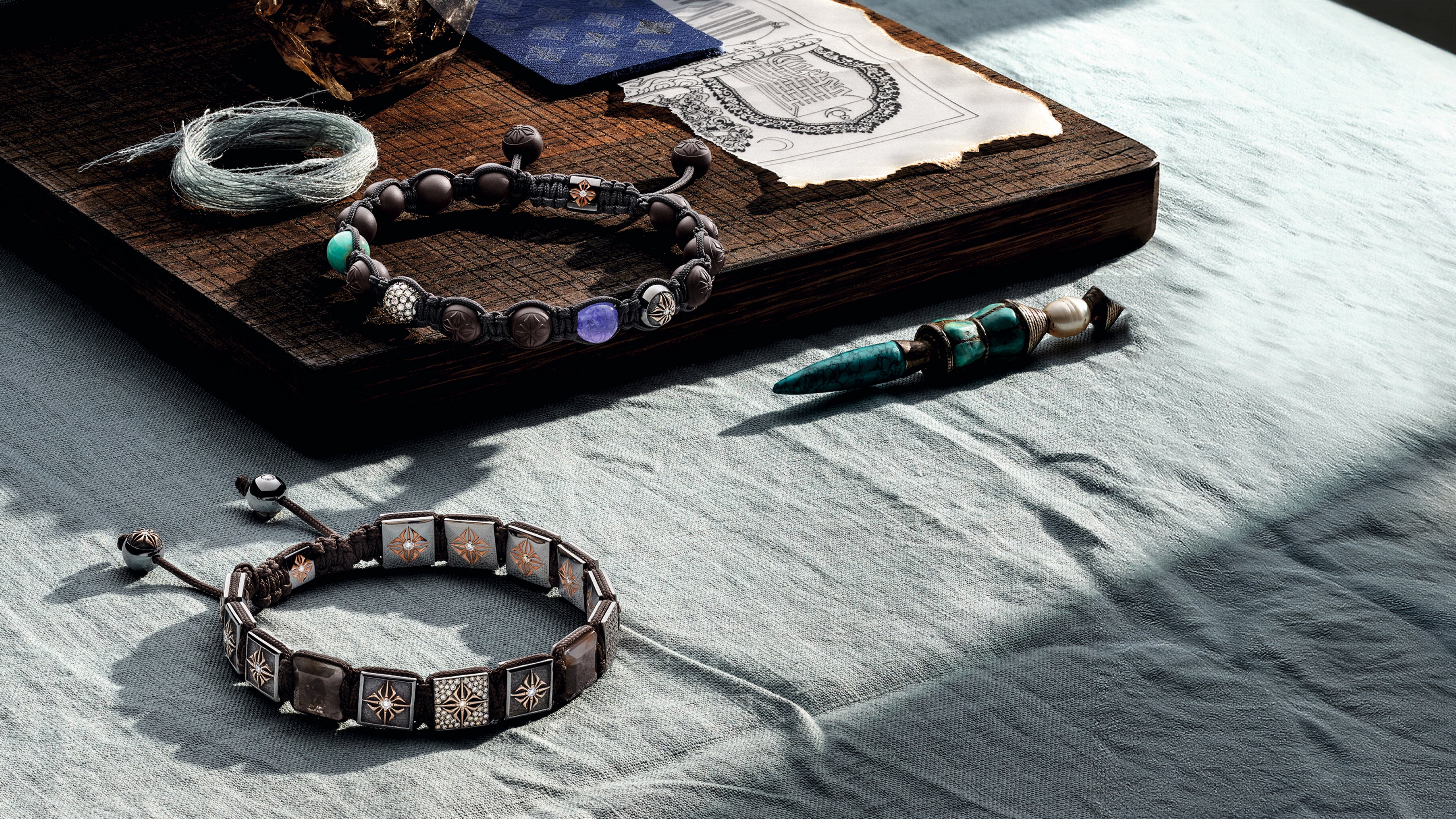 Shamballa bracelets arranged on a stone surface — handcrafted in Copenhagen